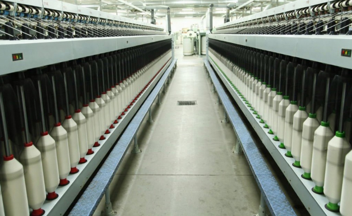 Fiber drafting machines aligning slivers for uniformity.