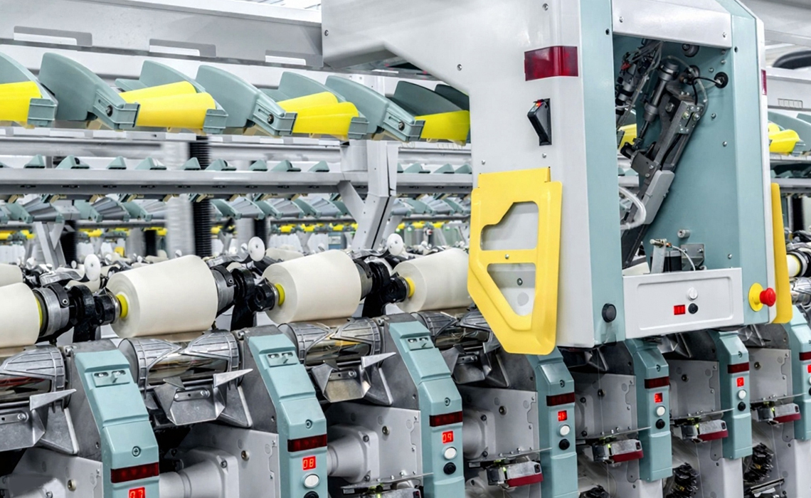 Electronic yarn clearer removing defects before cone winding.