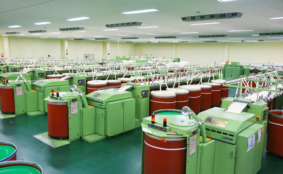 Fiber drafting machines aligning slivers for uniformity.