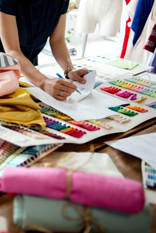 Textile designers creating digital patterns in a modern studio environment